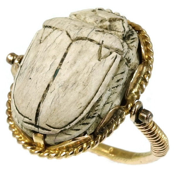 Typical Egyptian scarab ring with cartouched scarab set in gold swivel ring